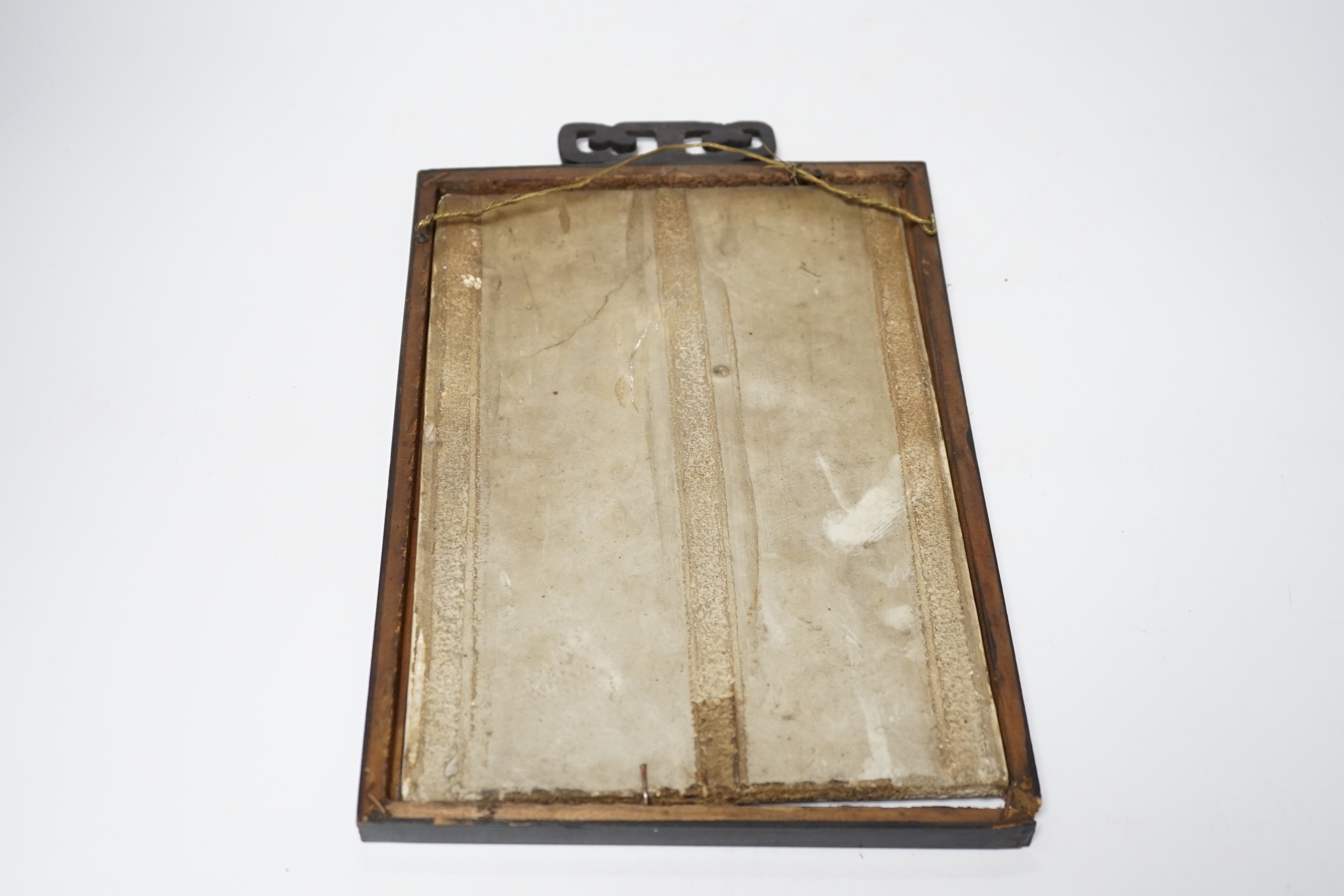 A late 19th century Chinese blue and white plaque of a bird, ebonised frame, 19cm wide x 30cm high including frame
